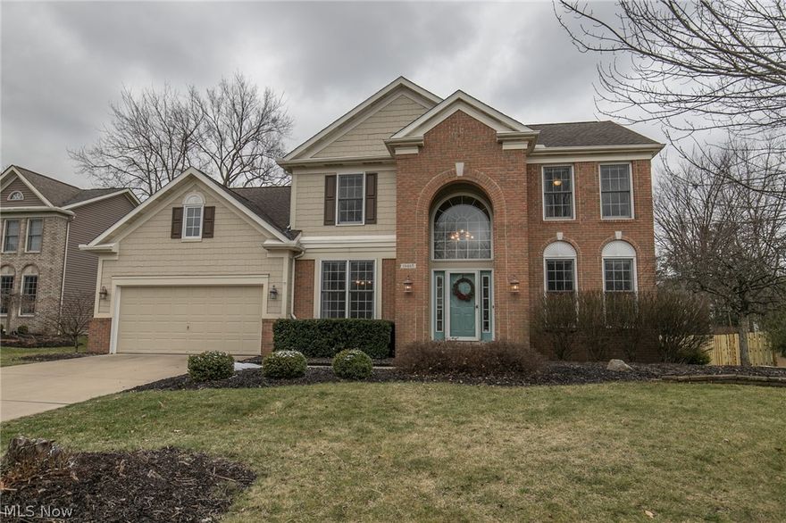 Welcome Home to 19465 Blue Spruce Dr.  This contemporary, move-in ready colonial is situated on a scenic green-space lot in the highly sought-after association The Woods of Strongsville, which provides convenient access to Route 82, I-71, the Ohio Turnpike, and ample avenues to Kinsner Elementary, Browns Headquarters, & all the amenities this dynamic city has to offer!  This meticulously maintained 4 bedroom, 2.5 bath colonial boasts over 3,000 sq. ft. between all 3 levels, and is sure to impress with manicured landscaping, partial brick facade, newer windows (2014)/roof (2010), freshly painted interior (2019), oversized 2-car attached garage, and multi-tier deck overlooking a parklike common area with tennis courts and a brand new playground! Featuring a vaulted foyer, 9 ft. ceilings, and gleaming hardwood floors, the main level offers a formal dining room, office, half bath and cozy living room w/fireplace open to the eat-in kitchen with all appliances included, refinished cabinets (