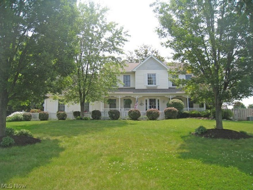 Exceptional 4 bedroom, 2.1 bath colonial with a white picket fence and a welcoming front porch.  Nestled on a private cul-de-sac, this lovely home features a 2-story foyer, a formal dining room with a tray ceiling, and a formal living room with French doors that opens to the family room.  The family room offers a wood burning fireplace and is open to the kitchen.  The gourmet kitchen has a center island, oak cabinets, stainless steel appliances, and an updated backsplash & countertops.  The large bayed eating area has a sliding door leading to the deck and yard.  Wood laminate flooring is on the 1st floor.  A spacious laundry room, a walk-in pantry, and a guest bath complete the 1st floor. The upstairs features a master suite with a glamour bath, a bay window, jetted tub, and double sinks.  There are 3 additional bedrooms and a  main bath on the 2nd floor.  The roof and hot water heater are less than a year old.  Completing this offering is a full basement with a finished recreation ro