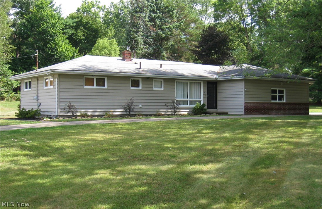 Beautifully updated Ranch on a large private lot! Big bright kitchen and eating area with stainless appliances and custom tile floor. Spacious Living Room with tall wainscoting and rich hardwood floors. 3 bedrooms, also with hardwood flooring and 2 new full baths! New furnace and central air in 2013. Updated hot water tank, electric panel and glass block windows. 2 car attached garage. Full basement. City water and sewer plus a well for the garden and lawn! Must see!