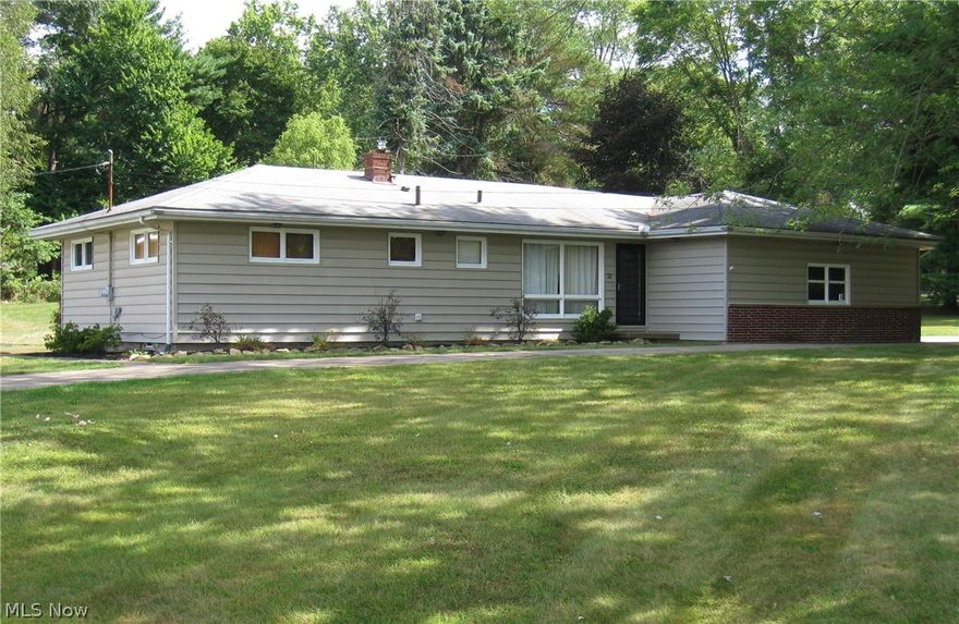 Beautifully updated Ranch on a large private lot! Big bright kitchen and eating area with stainless appliances and custom tile floor. Spacious Living Room with tall wainscoting and rich hardwood floors. 3 bedrooms, also with hardwood flooring and 2 new full baths! New furnace and central air in 2013. Updated hot water tank, electric panel and glass block windows. 2 car attached garage. Full basement. City water and sewer plus a well for the garden and lawn! Must see!