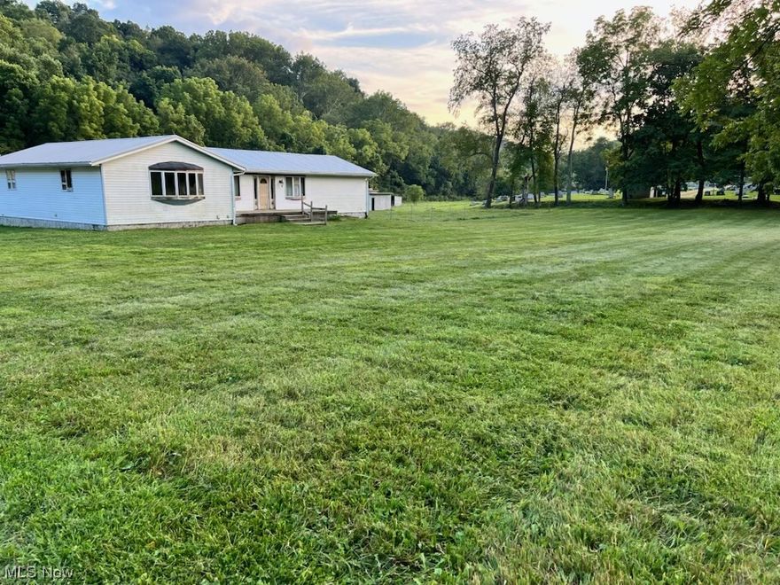 What a beautiful piece of flat land.  Plenty of opportunity to develop and add more new homes. Mineral rights are being transferred to buyer. And what quiet neighbors you have. This is a great investment opportunity or a loving new family home. Enjoy the unique design of the kitchen and its features.  Three large bedrooms with 3 large bathrooms. Everything on the one floor. Plus, there’s a basement that can be used for storage. New metal roof in 2021. Yes the home needs a little TLC, but nothing that anyone can’t handle.  Because the sellers never resided in this home, they had a home inspection done. It will be sitting on the counter to be shared with anyone who schedules a showing.  Call your agent today to view.