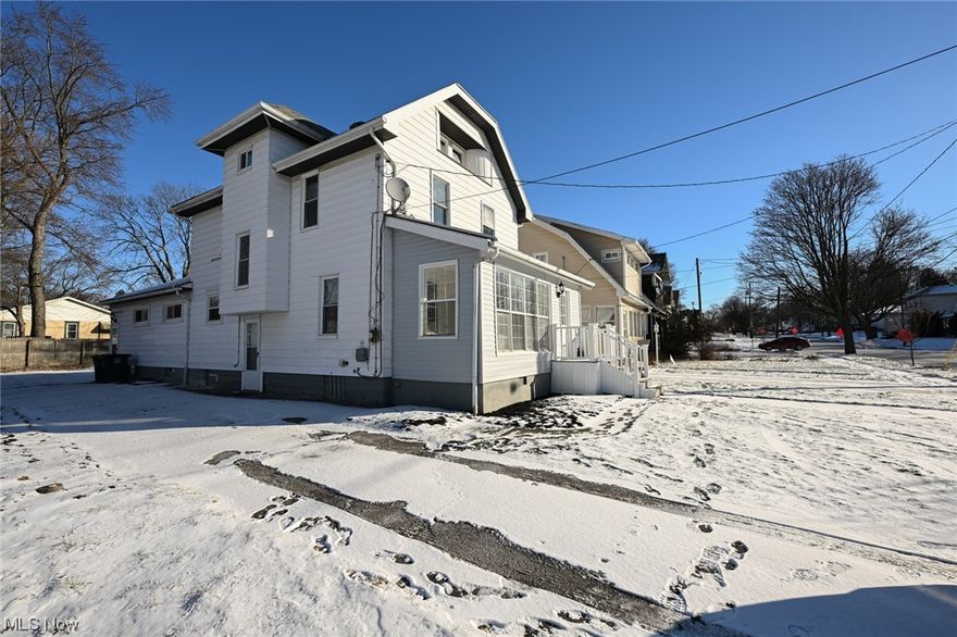 THE WILL AND GRACE TEAM PROUDLY PRESENTS 197 E ARCHWOOID AVENUE. Originally built by Cleveland Area builders. This 3 Story , 7 Bedrooms, 2 Bath Colonial located in Firestone Park, on a beautiful tree lined street appropriately called Archwood Ave., named because of the trees of years past, formed an arch between the homes. Over the years of ownership, this home was lovingly cared for and adapted, expanded upon to include an addition which includes a master suite which served as a large bedroom and an area where family could congregate and enjoy all the amenities on the first floor. The current owners have painstakingly renovated and brought it into present day. Features include; vinyl sided wrapped porch, There are "trex" steps leading to the porch with vinyl railings.  Upon entering the porch more features  include LVP flooring and vinyl clad windows,  this could be used year around. The original large oak front door greets you upon entrance. Immediately you will notice all the rich hardwoods, includes flooring, trim, baseboards, high ceilings and expansive room sizes. Newly refinished floors, interior walls have been freshly painted. LR boasts a fireplace, you will notice the large  Dining room w a large triple window. The modern SS applianced kitchen with new LVP floor, ivory soft close cabinetry with Quartz Countertops. Kit also includes Range, Refrig with ice maker, Microwave, Dishwasher, Disposal, SS Farmhouse style Sink with the latest sprayer faucet. Kitchen also includes a pantry for more storage. The Breakfast Room includes an expanded eating area and a pantry. The Main Floor includes a Full Bathroom newly renovated. You have finally arrived at the amazing Master Suite , with 3 cedar lined closets and a beautiful hardwood floor. Second and Third Floors have all been  done in new LVP. Second Floor boasts 4 bedrooms with new ceiling Fans, plus fully renovated Bath: new toilet, vanity, Bathtub with shower enclosure. There is Third Floor with 2 additional BR .