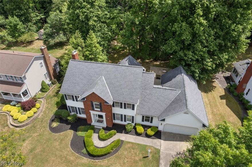 Welcome to 2973 Gatsby Lane. This stately colonial in the highly sought after Gatsby Estates is sure to impress.  This beautiful, wooded neighborhood provides large lot sizes, mature trees and sprawling green space.  This home features neutral decor throughout, fresh paint and an abundance of natural light. Upon entering you are immediately met by a two-story foyer, staircase and large chandelier. The first floor offers three living spaces as well as a large open concept kitchen, formal dining, half bathroom and office/ Flex space.  The formal living room offers a set of glass french doors that separate you from the family room off of the open kitchen. The family room features a brick wood burning fireplace and bay window. The open kitchen features a large island set against clean, white cabinets and neutral back splash. The microwave is brand new and all appliances are included. On the back of the home is the stunning 4-season great room, complete with vaulted ceiling, skylights, walls of windows that pour in the natural light, heated floor, electric fireplace, wet bar and sliding glass doors that lead directly to the large paver patio and fire pit. The office/ flex space could easily be converted into a fifth bedroom and is located across from the first floor bath and laundry. Upstairs you will find 4 bedrooms, the main bath and the expansive primary suite. The primary greets you with double doors that lead into the large bedroom with vaulted ceilings. The primary bathroom features a large jetted tub, stand alone shower, water closet  and large vanity. Off of the bathroom you will find a generous walk in closet and laundry suite! The basement offers both a large finished rec-room as well as unfinished storage space.  For additional storage you will find an extended 3 car garage. The Air conditioning unit was replaced in June 2024.  Seller is offering1 year home warranty through APHW. Book your private showing today!