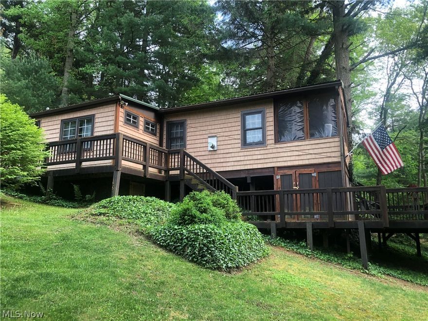 If you've been patiently, (or impatiently!) waiting for a superb lake cottage to call your own, your day has come at beautiful Leesville Lake! The full-time owner occupant has maintained this cozy comfy three-bedroom home with pride, and in meticulous condition. Living room plays host to a majestic stone-flanked fireplace in true lodge style. Kitchen features stainless steel appliances, a breakfast bar, and Corian counters. The adjacent dining area is spacious, and includes a wood-burning stove and lots of natural light. Tongue-in-groove ceilings and floors throughout make for a truly authentic cabin vibe. Newer stainless front laundry appliances will convey with the home. Take in the picturesque views of nature from the wraparound composite deck, or the screened-in breezeway. Additional storage room under the deck. Metal roof on both the home as well as the 20'x20' insulated storage/workshop building, which was built in 2012. There's also a second "she-shed," perhaps for gardening sup