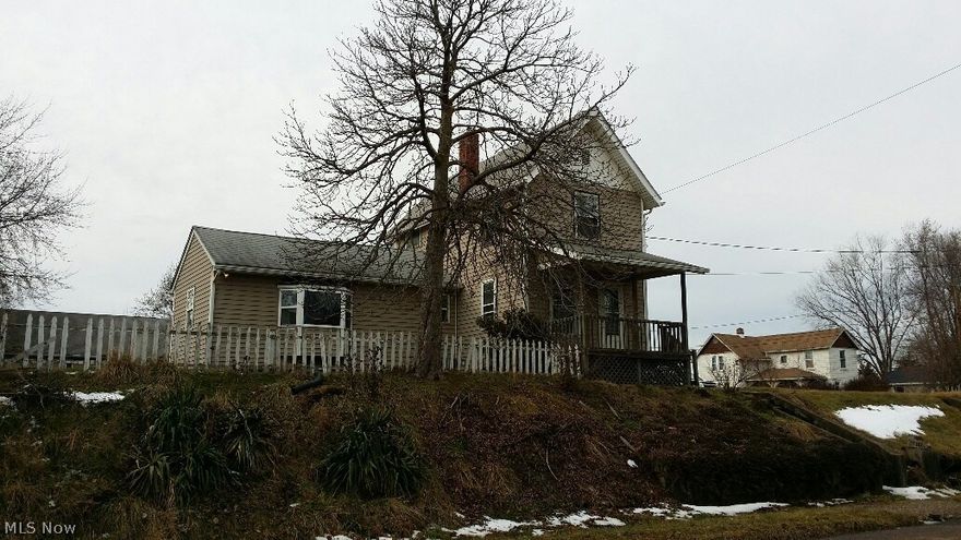 Spacious 2 story home with 2 full baths and nice large lot. Possible 3 bedrooms.  3 car garage.  Needs tlc.