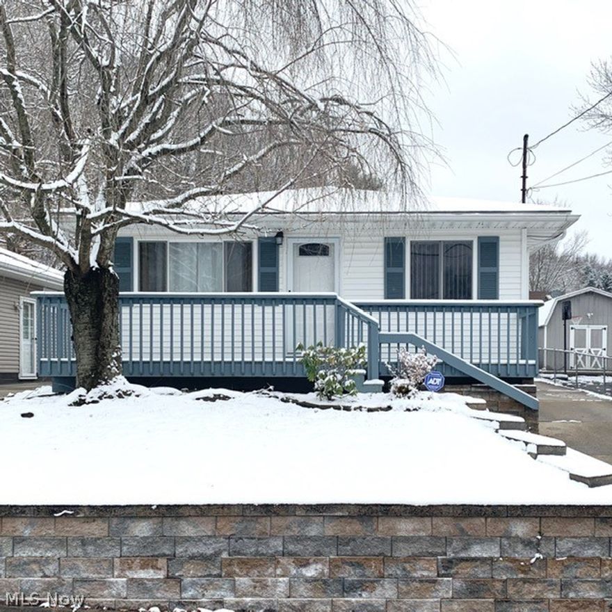 991 Burbank Ave. is delightful with many updates.  It is a 3 bed, 2 full bath, ranch style home with an oversized (23 x 26.5) 2 car detached garage perfect for your storage needs.  Centrally located on a quiet street, this home combines the luxury of easy access to expressways, shopping and fine dining along with peaceful and relaxed living.  With over 1600 sq/ft of finished living space, a sizeable front porch and a huge, beautifully designed back deck, this home is perfect for family comfort but will not disappoint the entertainer.  Upon entry you'll find the large living room with gorgeous, refinished hardwood floors that span the hallway and bedrooms.  Each bedroom is equipped with double-door closets and the master features a glass slider out to the back deck/yard.  The kitchen offers high-end wood cabinetry and the amount of space has been maximized with additional built-in storage/pantry and a vast amount of counter space.  The dining area adjacent the kitchen and the hall bath,