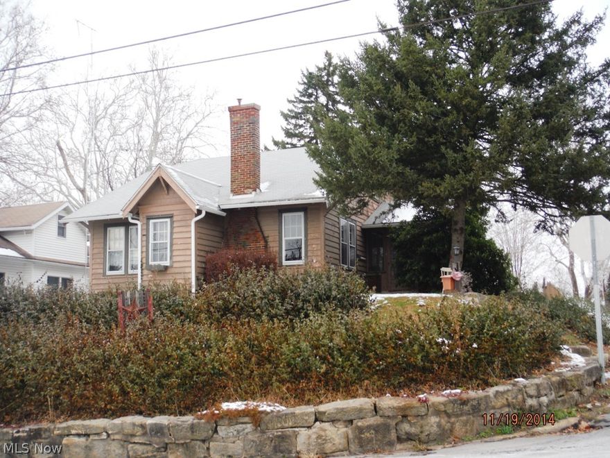 Cute and Cozy 2 or 3 Bedroom nestled on a corner lot offering screened porch, hardwood floors, large back yard and off street parking.