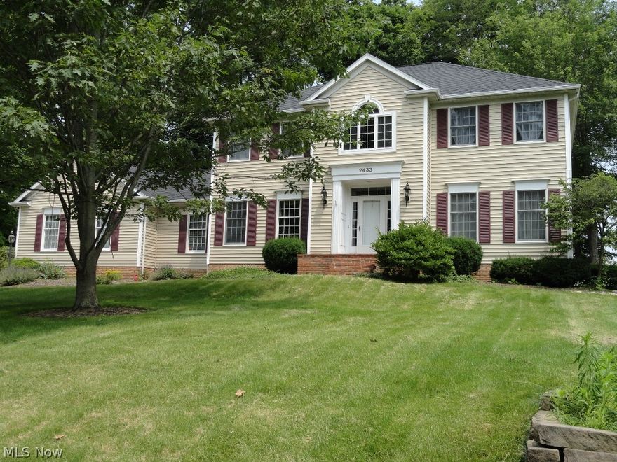 This custom Folta built home is located in Hudson Park Estates, a pool and tennis community in Hudson, OH. This home boasts detail crown molding throughout the first floorand features a large eat-in kitchen with granite counters and newer appliances. This area is  open to the family room which features a cathedral ceiling, floor to ceiling brick fireplace and detailed windows with half crowns. A gracious central foyer w/ hdw flooring has lots of room for greeting guests and is flanked by the formal living room and 18 x14 hardwood floored dining room. A private study w/ hdw floors and built-ins, over-sized laundry, and half bath complete the first floor of this home.  The recently refinished deck overlooks a private wooded lot and most of the property has been tastefully landscaped in the last two years.The partially finished lower level with full bath, cedar closet and multiple storage areas provides more living space and the  unfinished half of the basement with access to the back yar