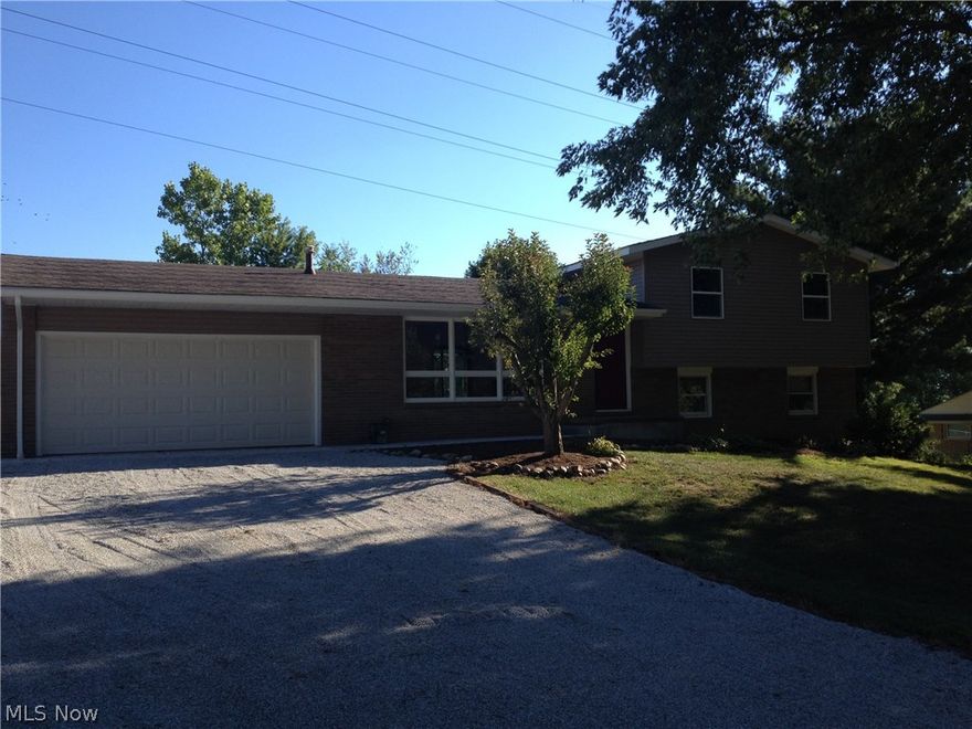 Plenty of updating has been completed on this wonderful Perry home. New Kitchen cabinets & counter, new oak trim & interior doors, new carpet in Family room, newly remodeled bath, beautiful hardwood floors throughout.  New in 2016 - siding, gutters, soffits,  downspouts & 2nd flr windows, furnace & concrete walk. New stainless steel range & refrigerator will be installed in the new kitchen!  Four level split has additional easy access stairway from garage to the basement.  Convenient country setting close to route 30 access.  A fantastic place to call home!