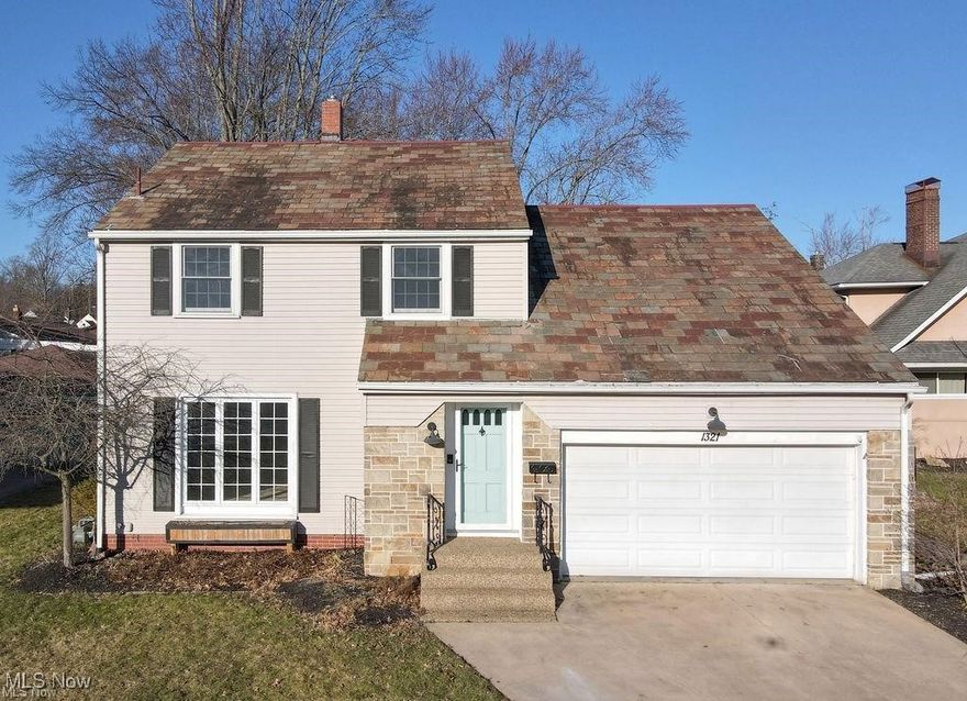 Step inside this charming colonial, full of character and ready for its next owner! The spacious living room welcomes you with abundant natural light and a cozy electric fireplace. Just beyond, the dining room shines with barn doors, an updated light fixture, beautiful original hardwood floors, and built-in cabinets.

At the back of the home, a comfortable family room with a wood-burning stove overlooks the expansive, private backyard. The kitchen, located in the heart of the home, features generous cabinet space, a custom live-edge breakfast bar, and a large pantry just down the hall. A convenient half bath sits between the mudroom, garage, and kitchen. The mudroom offers excellent storage and direct access to the backyard—perfect for keeping everyday essentials organized.

Upstairs, you’ll find three generous bedrooms with walk-in attic storage. Two bedrooms include double closets, while the primary bedroom showcases the original hardwood floors. The full bath is centrally located in the upstairs hallway for easy access.

Step outside to enjoy your own backyard oasis with a brick patio, large shed with electricity, and an additional storage shed for garden tools. Recent updates include a new hot water heater and garage door opener.

With a little TLC, this home offers incredible potential, timeless charm, and plenty of space inside and out!