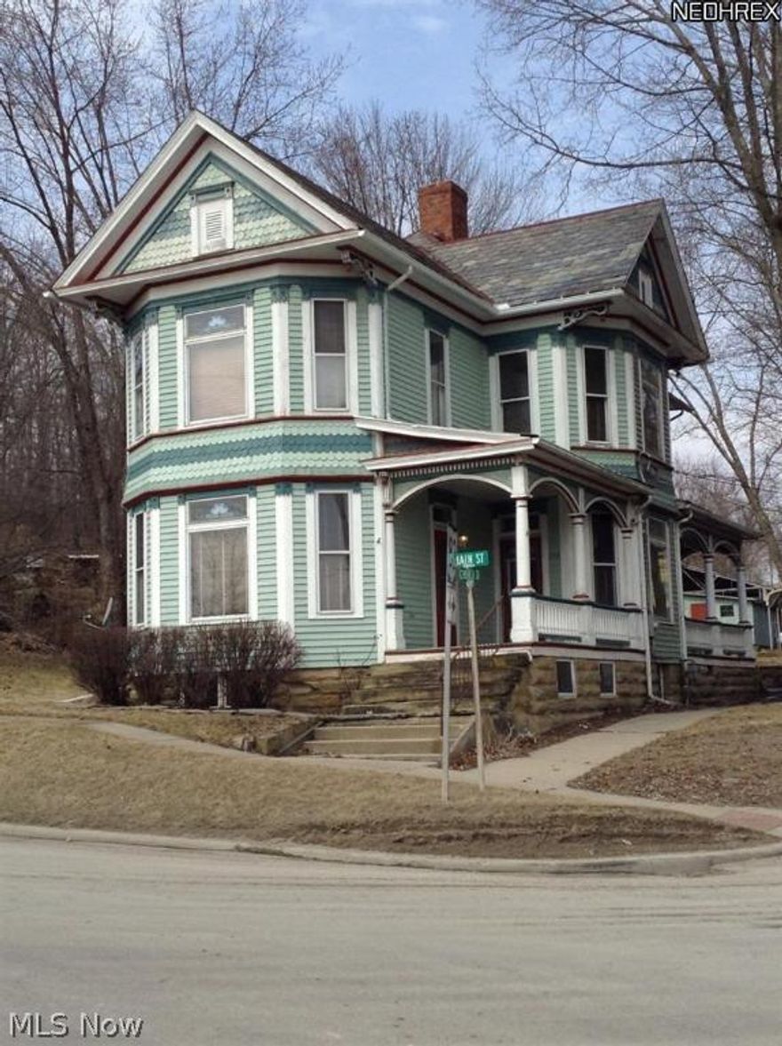 This very spacious Queen Anne Victorian home in the heart of Cumberland, offers 4 large bedrooms and 1.5 baths. Beautiful original woodwork, doors with transoms, stained glass in windows, unique pocket door, and many other original features throughout.  Lots of natural light, formal dining room, updated kitchen with appliances and wood parquet flooring, 1st floor laundry room and half bath located off the kitchen. Updated full bath and plenty of storage with built-ins.  New carport in rear of large backyard. Public sewer recently installed and owner currently paying assessment of $80.00 per month. Owner has paid tap fee, hook-up and inspection fees.