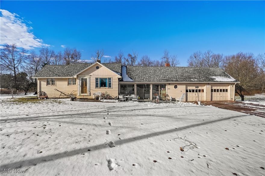Some things are simply better in the country. Wide-open skies, peaceful views of rolling farm fields, and room to breathe—this inviting property offers the slower pace and simple beauty of rural living on over 4 acres.

A screened-in front porch sets the tone, perfect for morning coffee or quiet evenings taking in the view. Inside, the home is warm and welcoming with a large country kitchen with wood plank ceiling, featuring a wood-burning fireplace insert, ideal for cozy gatherings. The layout includes two bedrooms, a nicely updated main bath, and plumbing already in place for a future primary en-suite. A comfortable den connects the kitchen to the spacious living room, currently used as a bedroom, offering flexible living space.

Major updates completed within the last three years include a 50-year shingled roof, heat pump, and well pump, and main bath, providing peace of mind. A 2-car garage with brick skirting adds everyday convenience, all within the Western Reserve School District.

If you’re ready to slow down, stretch out, and enjoy the beauty of country living—this home is ready to welcome you.