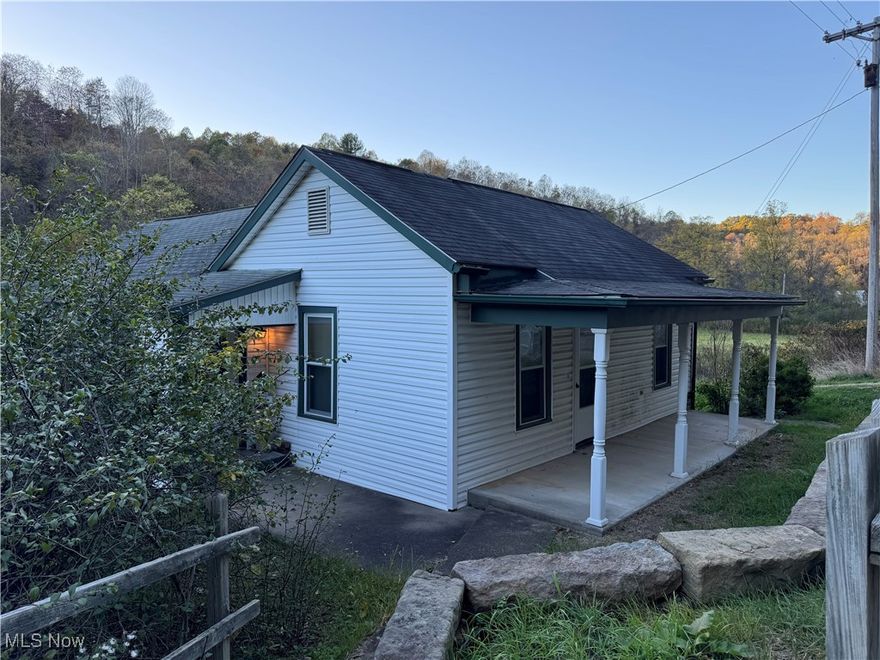 This property is in a wonderful location, located in a valley of the beautiful Switzerland of Ohio,  It is the midst of Wayne National Forest, a hunter's delight.  There are 2 houses on the property.  One house is move in ready.    The other house needs some work.  There is also a huge barn, with some of the flooring needing repaired.  Plenty of room for a garden!  A nice little babbling brook in the back. Explore this beautiful piece of property, with almost 5 acres!   It is only 7 min. from the beautiful Ohio River, if you like boating or fishing.  15 min. from shopping, banks, etc.. 5 min. from a local Community Center that offers many activities.  This one will go fast!