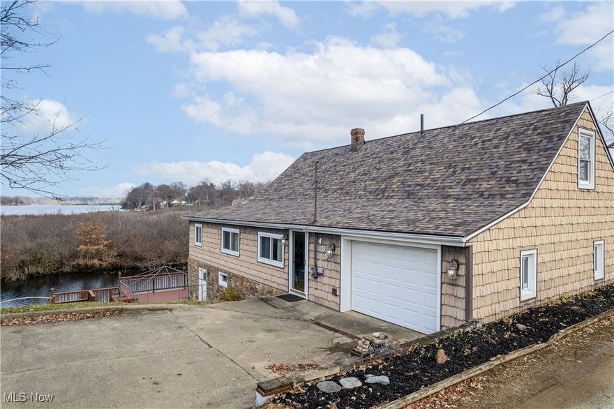 Don’t miss your chance to own this lakeside gem on Long Lake in Portage Lakes! This 3-bedroom, 1-bath home comes with its very own dock, perfect for boating, fishing, or simply enjoying the water. Step inside through the front door or the attached garage, and you’ll find the main floor featuring three comfortable bedrooms, a full bathroom, and a spacious living room.
The walk-out lower level offers even more living space with a kitchen, second living room, laundry area, and double doors that open to a deck overlooking the lake—a great spot to relax or entertain. The basement is also plumbed for a second bathroom, giving you the option to add even more convenience.
Recent updates include a new roof (September 2022), updated doors (2022), and a newer furnace for peace of mind. Plus, you’ll love being just a short walk from local restaurants and entertainment.
Waterfront living, modern updates, and unbeatable location—this home has it all!