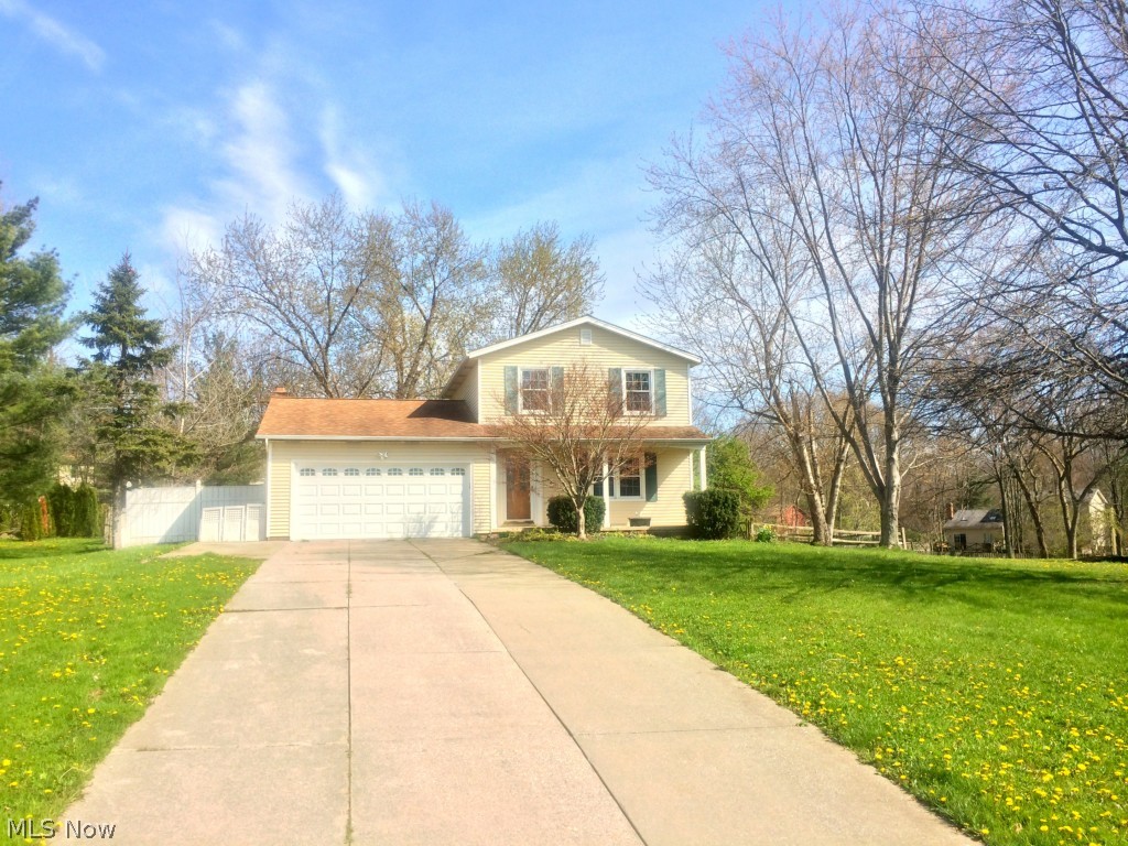 Slow curving road lead you to this clean colonial home tucked away in a lovely treed neighborhood on over half an acre with great curb appeal. The whole home has new carpet, fresh paint, and newer windows. The first floor has a spacious family room, living room with fireplace, brick mantel, and focal lighting. The kitchen is open to the dinning area and family room. This layout is great for entertaining and holidays. The dining room has glass sliding doors that overlook the large backyard. Master bedroom has walk-in closet. Plenty of space in basement for storage. 2 car attached garage.