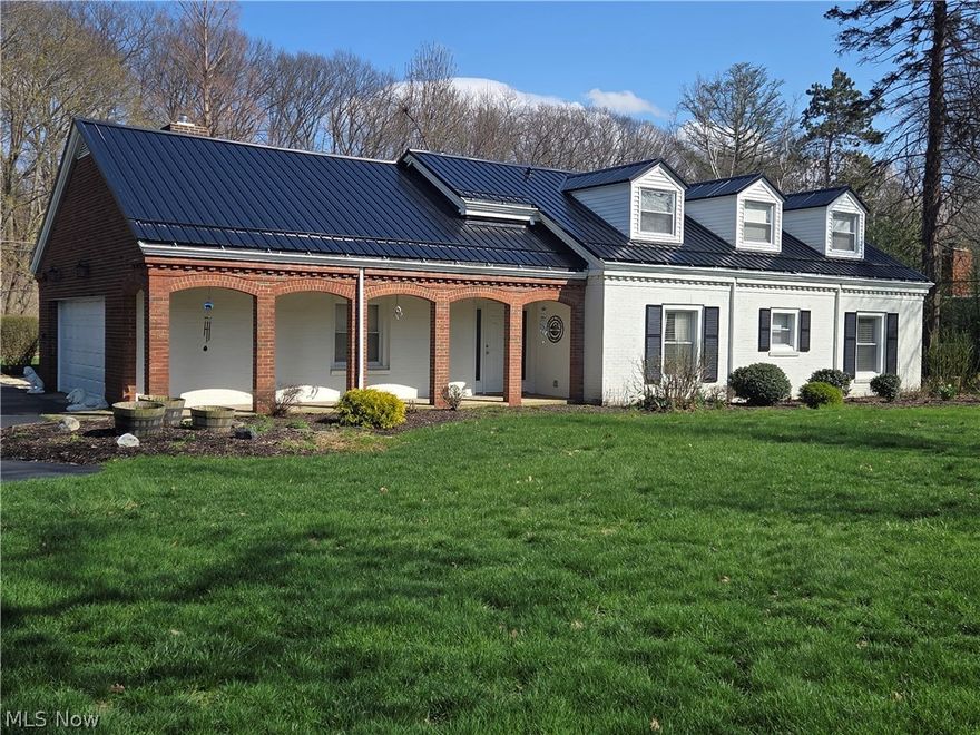 Situated on a serene tree lined street placed perfectly among nature's harmony on a park-like setting is a true dream home! Here luxury is redefined in this massive 3500+ sq ft home that has been completely transformed and offers its new owners the feeling of new construction without the wait and built in a time period of true craftsmanship. Inside you will find a 5 bedroom 3 bath masterpiece of an executive home you've been waiting for. From its strong brick facade to the high quality flooring throughout the main floor, and what a main floor that is, wide open and crisp and clean. The chef's kitchen is a showstopper with soft close cabinetry, premium granite and stainless steel appliances with access seamlessly to the living room and dining areas. A rare feature of this home is dual master suites, one on the main and one on the 2nd level, along with 3 other bedrooms in the home. Relaxation awaits in the stunning enclosed back sunroom accessible directly from the home! This sun drenched sanctuary offers panoramic views of the huge paver patio and yard perfect for entertaining or relaxing with the paper and morning coffee. A high quality new metal roof has just been installed for the peace of mind that comes from owning a home that has it all, including a very large storage barn, just built in the side back yard for work or storage! Move on in and claim the best of the 44077 and live the lifestyle this home provides.