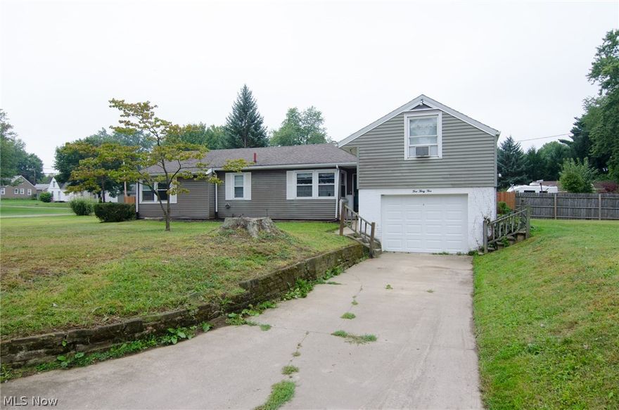 Double corner lot in Perry Township!!  Don't miss out on this incredible opportunity.  Located on nearly a half acre, lending itself to an additional garage/pole building, home addition, garden or just a huge space to call your own.  Enter into the large, open living and dining area. Here you have a working, wood burning fireplace, carpeted living room, vinyl floored entry and dining area and access to the patio.  The kitchen offers a gas range, built-in microwave, refrigerator, dishwasher, garbage disposal and eating area.  Around the corner you will find the family room/den and down the hallway, two bedrooms and a full bathroom.  Off of the living room on the second level is the large master bedroom with another working, wood burning fireplace.  There is a second 3 piece bathroom in the basement, as well as the washer/ dryer and a work bench.  Hardwood floors beneath the carpeting.  Freshly painted basement, newer furnace (3 years), updated electrical, vinyl replacement windows and a