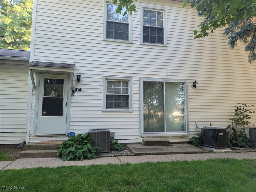 Welcome to the perfect solution to a busy lifestyle- home ownership yet less upkeep. This 2 bedroom 1 bath condo located in the Green Local School District is a hop, skip, and jump to highways, businesses, recreational activities, and more. Enter this cozy condo and be welcomed by a spacious living room and dining area with a sliding glass door. The kitchen is a galley-style with breakfast bar and comes fully applianced with brand new countertops. Convenient stackable washer and dryer stay with the home and are located in the utility closet off the kitchen. Upstairs you'll find the two bedrooms and full bath. The home has an under the stairs storage closet on the first floor and linen closet on the second. The kitchen, dining area, entryway, and bathroom all have new vinyl plank flooring. The entire condo has been freshly painted and is ready for you to simply move in and enjoy. The home also includes a 1 car garage which is accessed from outside of the condo but does have a garage doo