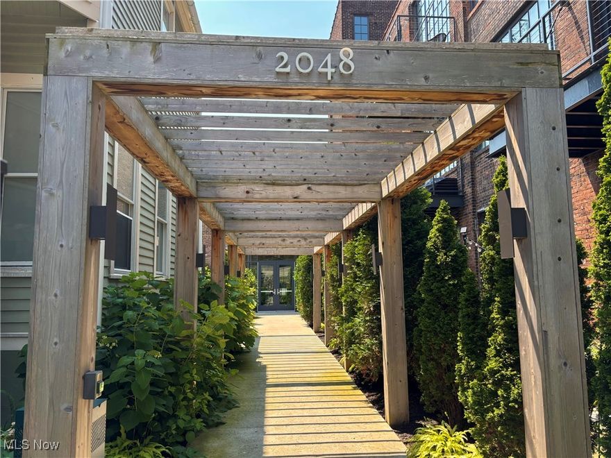 Welcome to the Tinnerman Lofts, a stunning blend of industrial heritage and modern luxury in the heart of Ohio City. Housed in the meticulously restored Tinnerman Steel Range Company building, this distinctive building offers a unique mix of character, comfort, and community.
Step outside the front door into a lush private courtyard—complete with fire pit, grilling station, a pizza oven, and side by side bocce courts. Inside, a dramatic two-story community living and working area features west-facing windows that flood the space with natural light, alongside a curated rotating art collection that brings a gallery feel to everyday living.
Additional amenities include a leafy rooftop deck, a fully equipped fitness center, bike storage, and a convenient pet wash station. Parking is available in a covered garage or gated surface lots. Enjoy an easy commute via I-490 or the Shoreway.
Tucked behind the courtyard for peace and privacy, yet just steps from Ohio City’s best coffee shops, restaurants, and breweries, including the newly opened onsite restaurant, Kyuu Juu. 
Each unit is thoughtfully designed with soaring 10-foot windows, sleek modern finishes, and kitchens tailored for both the home cook and entertainer.
