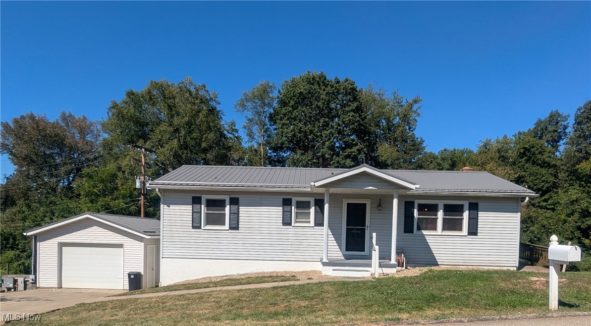 Enjoy your Future Beautiful Ranch style home featuring 3 Bedrooms, 1 Bathroom, Living Room, and an Eat in Kitchen on the main floor. From the Kitchen, you will enjoy your view of nature from inside or on the covered back deck. Partial wrap around deck with ramp and no steps lets you onto the yard as well. Very close to Barnesville Schools, grocery stores, gas stations, dining, and many other options this community has to offer. Part of the basement is finished drywall ready for a fresh coat of paint. A 2nd bathroom in the basement is an option as there is already a shower installed and plumbing for vanity and toilet. Brand new (just installed days ago) sliding door from basement, lets you step right onto back patio and the backyard. Basement also features a working wood stove. Breezeway from garage is an added plus, as well as many opportunities for the large basement. Newer updates include a metal roof that was installed in 2022, newer hot water tank, and flooring. This home is a must see!
