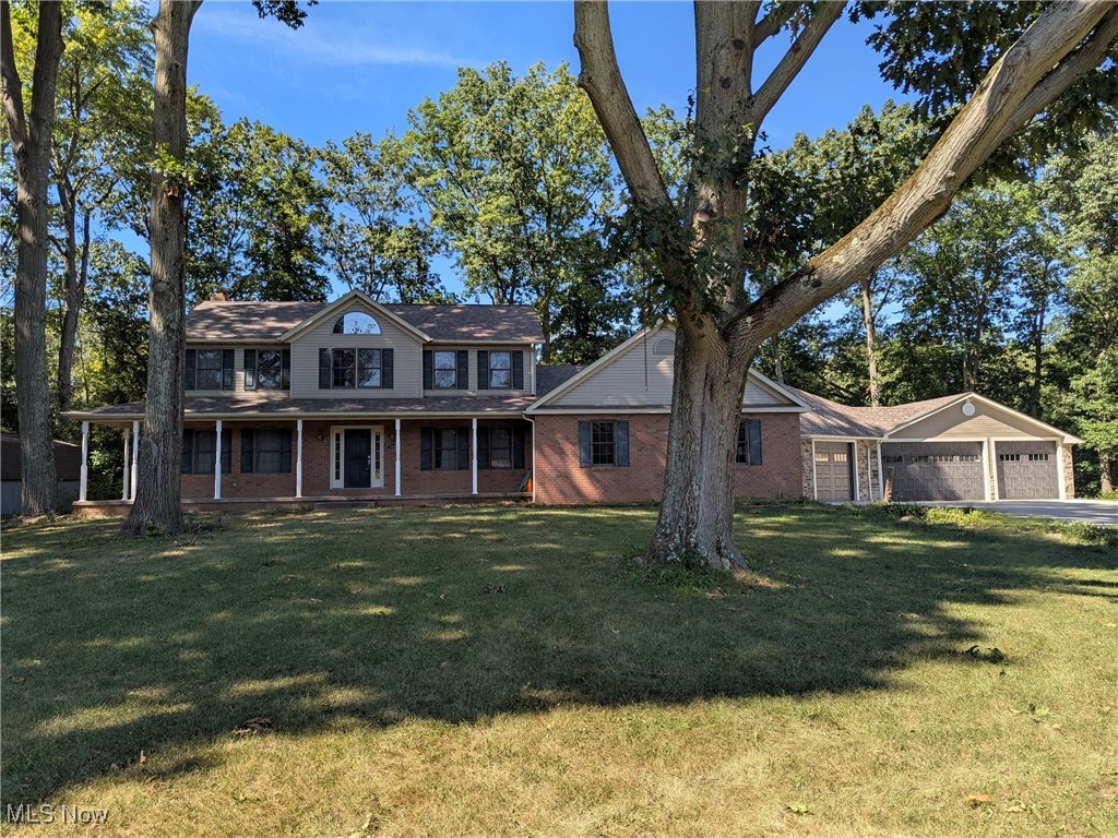 Rare opportunity in Springfield Township—this 6-bedroom, 4-bath Colonial is designed for those who need extra space and versatility. The property features a 5-car garage, two full indoor kitchens plus an outdoor kitchen, and multiple gathering spaces inside and out. The main kitchen opens to a 25’x15’ deck overlooking the backyard, while the finished walkout lower level offers a complete second living area or entertainment space with direct access to a 24’x23’ patio. Outdoors you’ll find an in-ground pool (needs TLC), pool house, and playhouse with electricity. Set on 1.08 wooded acres on a shared, private driveway, which serves only four other homes, this is an ideal setting for those who value privacy and function. Whether you need room for extended family, hobbies, or entertaining, this home delivers unique amenities rarely found in one property.