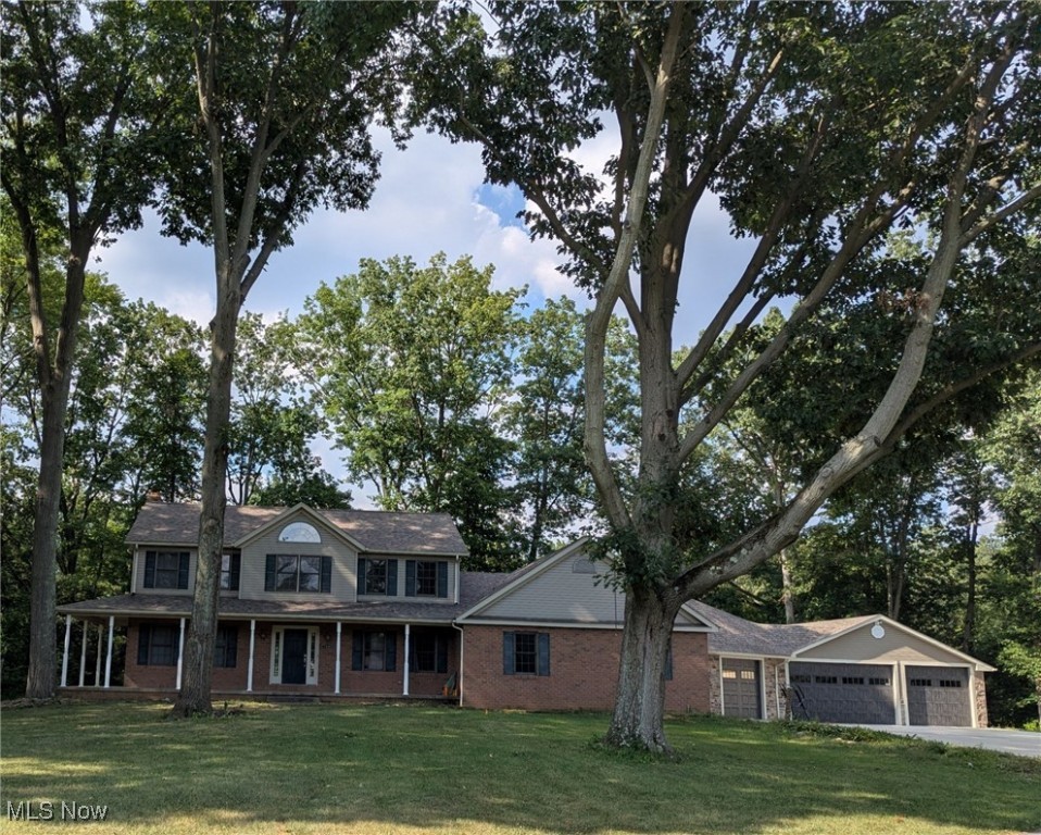 Rare opportunity in Springfield Township—this 6-bedroom, 4-bath Colonial is designed for those who need extra space and versatility. The property features a 5-car garage, two full indoor kitchens plus an outdoor kitchen, and multiple gathering spaces inside and out. The main kitchen opens to a 25’x15’ deck overlooking the backyard, while the finished walkout lower level offers a complete second living area or entertainment space with direct access to a 24’x23’ patio. Outdoors you’ll find an in-ground pool (needs TLC), pool house, and playhouse with electricity. Set on 1.08 wooded acres on a shared, private driveway, which serves only four other homes, this is an ideal setting for those who value privacy and function. Whether you need room for extended family, hobbies, or entertaining, this home delivers unique amenities rarely found in one property.