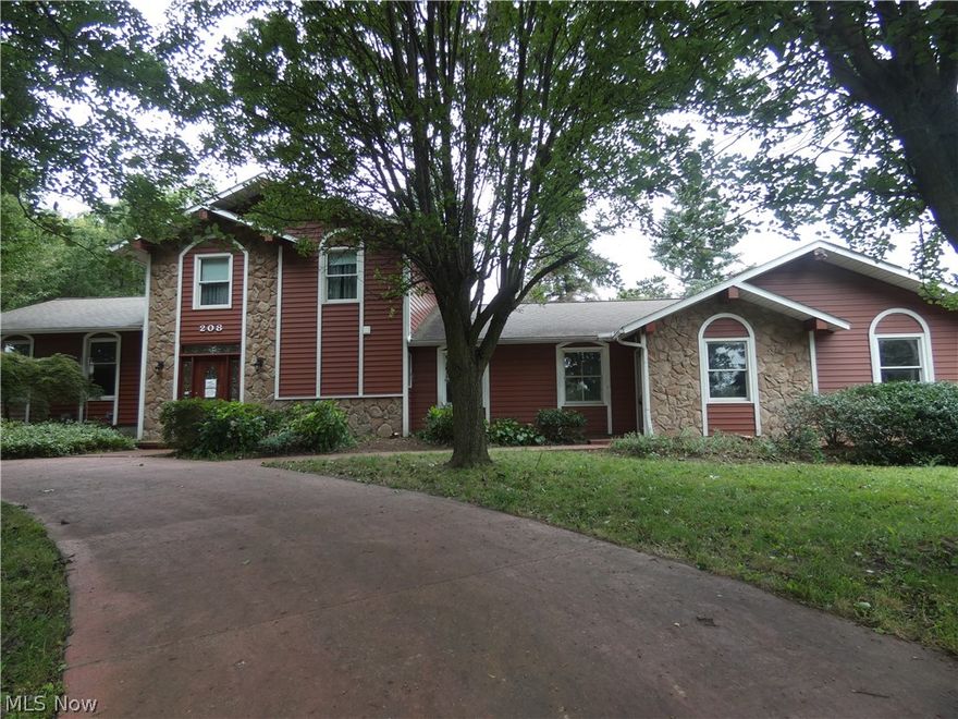 Stately Colonial on 1.45 acre lot. 3 car attached garage  3 car detached garage. Huge deck off the back of the house. Dramatic Circular drive for visitors plus side entry garage with drive.  First  Floor master and first floor full bath. Huge kitchen! Family room and  4 season room off the back of house. Master suite with glamour bath on second floor and  2 other bedrooms and a full bath.