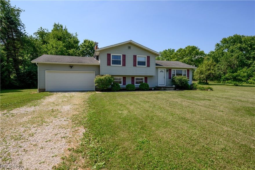 What a gem! Check out this stunning split-level with so much to offer! Situated on almost 4 beautiful acres with updates galore, this is definitely one to see! Make your way up to this amazing home and get ready to make it your own. Walk in the front door and you come to the spacious living room which offers a huge picturesque window allowing for a ton of natural light. Just off of the living room is the gorgeous kitchen which has been wonderfully updated with stainless steel/black appliances. The open concepts flows beautifully into the dining space and would be perfect for those that like to entertain with a sliding glass door that goes out to your back deck and overlooks the backyard with beautiful views. Make your way up to the upper level and you have a generously sized master bedroom, two additional large bedrooms and a full bathroom that has been wonderfully redone. On the lower level there is another family room which is complete with a stunning fireplace plus a 4th bedroom and