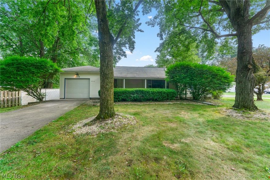 Welcome to this beautifully remodeled 3-bedroom, 2-bath ranch in Howland Township, move-in ready and full of charm! Located on a quiet, well-kept street, this home greets you with a covered front porch and a bright, welcoming entry that opens into a cozy living room featuring new carpet, a fireplace, and energy-efficient vinyl windows. The kitchen has been completely updated with white cabinetry, quartz countertops, a classic subway tile backsplash, stainless steel sink, and a shiplap accent wall. There’s plenty of space for an island and a dining nook at the rear that opens to the backyard, making it perfect for everyday living or entertaining. All three bedrooms are on the main level, each with great closet space and new carpeting. One bedroom also offers main-floor laundry hookups for added convenience. The full bathroom features a porcelain-tiled tub surround, modern vanity, new toilet, and luxury vinyl plank flooring. The finished lower level adds even more living space with a cedar-lined closet, half bath with a private shower area, storage room, and a walk-out basement with a built-in bar, a great spot for relaxing or hosting guests. Additional updates include vinyl siding, a 100 amp electrical panel and new furnace. Located in the highly rated Howland Local School District, this home offers both comfort and peace of mind. Schedule your showing today and see why this Howland ranch is ready to be your next home!