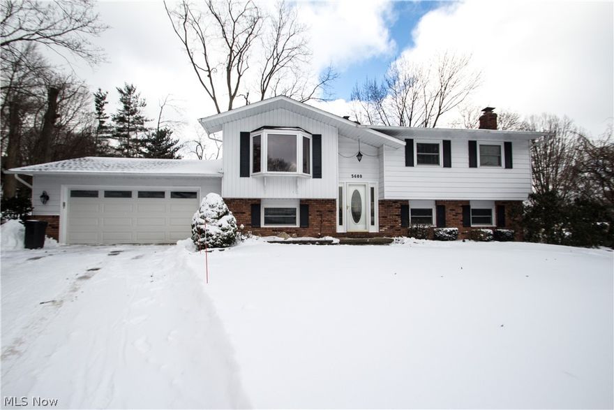 Welcome home to a beautifully maintained and updated bi-level in the heart of South Willoughby.  This home boasts updates throughout the upper and lower level beginning with the front exterior and garage doors.  Upon entering you will find an updated cherry kitchen complete with recessed lighting, beautiful granite countertops, a large island and stainless steel appliances.  The kitchen was updated in 2016 and a wall was removed to make the dining space more open to the kitchen. Large ceramic tiles are in both rooms.  Enjoy outdoor living through the French doors on the large, two tiered deck with patio at ground level.  Most windows have been replaced, including the large bay window in the living room. On the main floor you will find 3 nicely sized bedrooms along with an updated full bathroom that has plenty of natural light through the skylight.  The lower level includes a large carpeted bedroom and a large mudroom/laundry room that has plenty of built-in storage.  Enjoy entertaining