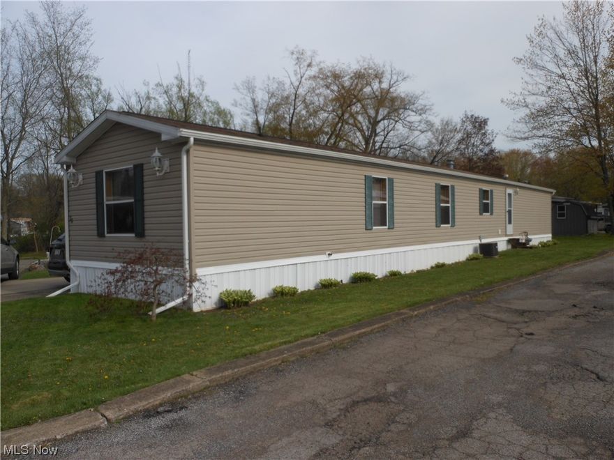 Don't miss this great opportunity to have your own home at an affordable price. This home located on a dead end street in the park offers 3 Bedrooms, 2 Full Baths and has been remodeled throughout.  The open floor plan has a Living Room w/Cathedral ceiling, Eat-In-Kitchen with newer stainless steel appliances that stay. The split bedroom plan has the Master Bedroom & Master Bath on one end and the other 2 Bedrooms & full bath on the other side. Laundry area off the kitchen has a sink. Outside is a covered porch, large deck for entertaining and a 14 x 10 shed for storage.  The drive will accommodate 3 cars. Buyers must pass a background check for the park.  Security deposit is $375.00.  Washer & Dryer are not included.