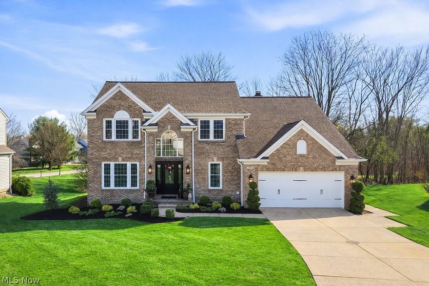 Welcome to this beautifully maintained colonial, ideally situated on a quiet cul-de-sac in the highly sought-after Glenwood Preserve community. Lovingly cared for and impeccably maintained by the original owners, this home is filled with warmth, pride and it's ready for its next chapter. Featuring 4 bedrooms and 2.5 bathrooms, the home blends timeless style with modern comfort and an ideal layout for both everyday living and meaningful gatherings. From the moment you step into the bright two-story foyer, you’ll feel the care and attention that has gone into every detail. The main level features gleaming wood floors, a welcoming living room, formal dining room, convenient first-floor laundry, and a thoughtfully designed kitchen that truly serves as the heart of the home. Complete with a large island, granite countertops, all appliances, and generous cabinet space, it's a place where meals are shared and memories are made. The kitchen opens to a sunlit eat-in area and a spacious family room featuring a cozy fireplace and built-in bookcase creating an inviting space to relax and unwind. Upstairs, the primary suite offers a peaceful retreat with vaulted ceilings, a walk-in closet, and a private spacious en-suite bathroom featuring dual separate vanities, soaking tub, and walk-in shower. Three additional bedrooms and a full bath provide comfort and flexibility for family, guests, or home office space complete the upper level. The finished lower level adds even more room to live, play, and entertain, along with abundant storage space to keep everything organized. Additionally, the attic offers plenty of storage with shelving. Enjoy outdoor living in the private wooded backyard with a spacious deck ideal for relaxing or entertaining. This home is part of a welcoming community with convenient access to a neighborhood playground, local schools, library, water park, and major highways. Schedule your private showing today before someone else calls it home!