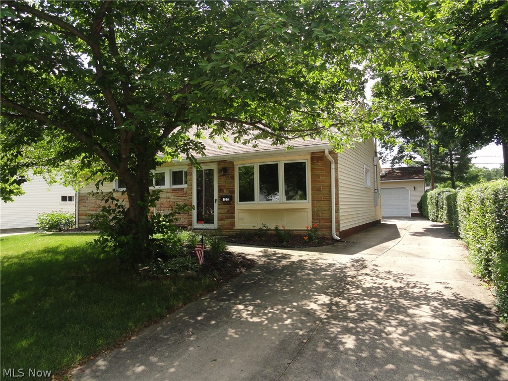 Sharp ranch in excellent condition located in a desirable Cuyahoga Falls neighborhood. Spacious living room with crown molding and bay window. Nicely updated kitchen with ceramic tile, oak cabinets, and stainless appliances. New windows throughout and updates bathroom too! Custom built, over sized 2 car garage with gas heater, insulated walls, 220 electric, cable, and phone. Stone patio overlooks lovely yard plus custom shed with electric. Double wide concrete driveway too.
