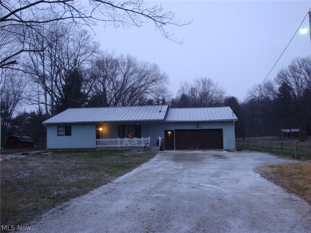 Move in ready charming 3 bedroom ranch with over an acre, two garages plus a pond. Awesome new kitchen with quality walnut creek cabinets& attached 1st floor laundry. Must see!