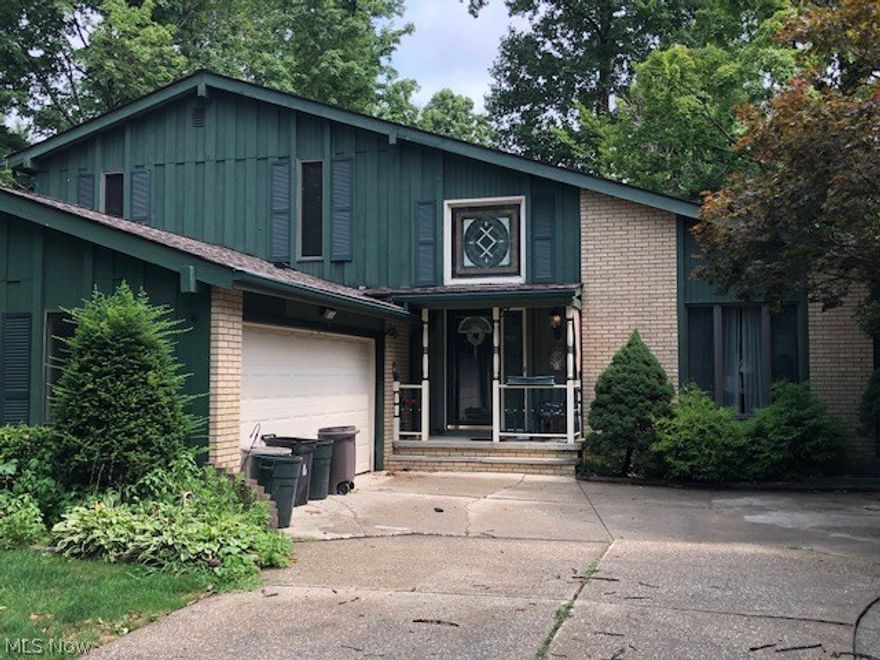 This is a very roomy home in a distinguished area with a low HOA cost annually that will include a clubhouse, pool, tennis court, basketball, wooded trails and creeks.  About 3000 sq ft of living space offering a formal Living Room open to  Dining Room, an Eat in Kitchen with tons of cabinets and storage pantry, sunken Family Room with Stone, gas fireplace.  A bedroom off the Family Rm can easily be made into an office or den.  Convenient First floor Laundry Room offering tons of storage room.  Vaulted foyer with a curved staircase and decorative planter area.  Upstairs with 3 excellent size bedrooms and baths.  Storage area off the Master Bdrm and Linen Closet in Hall.  Full Basement has finished "Lodge" for entertaining and still has lots of area for storage.  Attached 2 car garage.  Covered Front Porch.  Wooden Deck can be great for those outdoor BBQ's with a beautiful view of a wooded lot, paver patio, landscaping and a soothing stream running curved along the backside.  This home