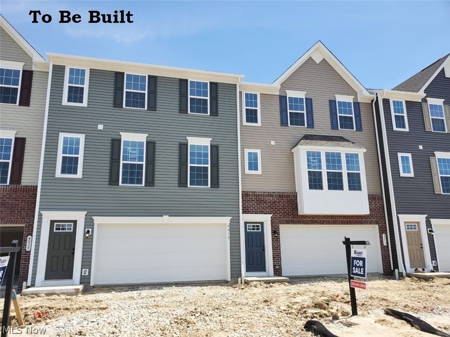 LAST CHANCE AT FALL 2021 MOVE-IN!  Single-family luxury living, meets low-maintenance lifestyle here at The Towns at Steels Corners.  This 3-story townhome is drastically reduced in price, as part of a “Quick-Move” building, and will likely be completed this Fall.  It boasts a gorgeous partial brick façade, included landscaping, and 2-car garage.  Inside, a finished lower level with ½ bath and walk-out to your large yard, is perfect for entertaining. The property backs to a lovely wooded view.  Upstairs, a HUGE greatroom is open to the kitchen, complete with upgraded espresso cabinets, granite, an almost 10’ island, SS appliances, a large pantry, generous dinette, and luxury plank flooring.  Tucked in a private nook, is also a ½ bath for this level.  The top level of the townhome is your sanctuary, complete with 2 beds at the front of the home, where they also share a full bath, next to the coveted upstairs laundry.  Your Owner Suite is an oasis, with large walk-in closet, and a design
