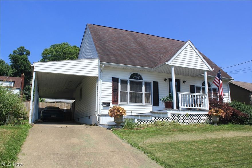 Charming Cape Cod with master bedroom and bath on the first floor.  Vaulted ceilings, hardwood floors, fireplace, sunroom/greenhouse.  Inviting comfortable kitchen and dining combination.  The large great room could also be living room and additional dining area.  Two bedrooms and bath on the second floor.  A gardener's backyard with raised beds, multiple storage and workshop buildings, with a heated and cooled "artists' cabin".  There is alley access with possible parking spots in the back and carport in the front.  Fenced yard.  Residents enjoy their street, neighbors and nice park.