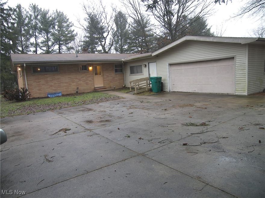 Solid 1959 brick & vinyl ranch on 3+ acres in desirable Novelty * Recent updates include electric boiler system and breaker panel * 2 full baths * breezeway * 1200+ sq. ft. basement * Hardwood in bedrooms * Vaulted great room & kitchen * Needs complete rehab / decor * across from elementary school * Estate - Being sold  AS IS