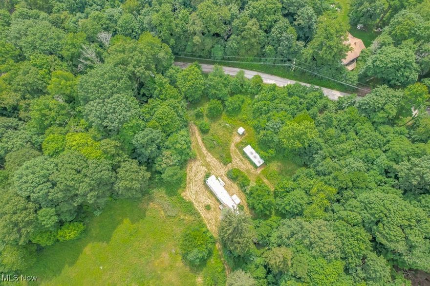 Incredible opportunity in Fairless Schools! This 2.84 acre lot includes a mix of open space and woods, giving you room to build, explore, or simply enjoy the outdoors. A mobile home currently on the property needs repairs or could be removed to make way for new construction. You’ll also find a small barn, shed, and an old log home, each in need of repair, but full of potential. Come take a look and imagine the possibilities! Condition of well and septic are unknown. Electric is turned off.