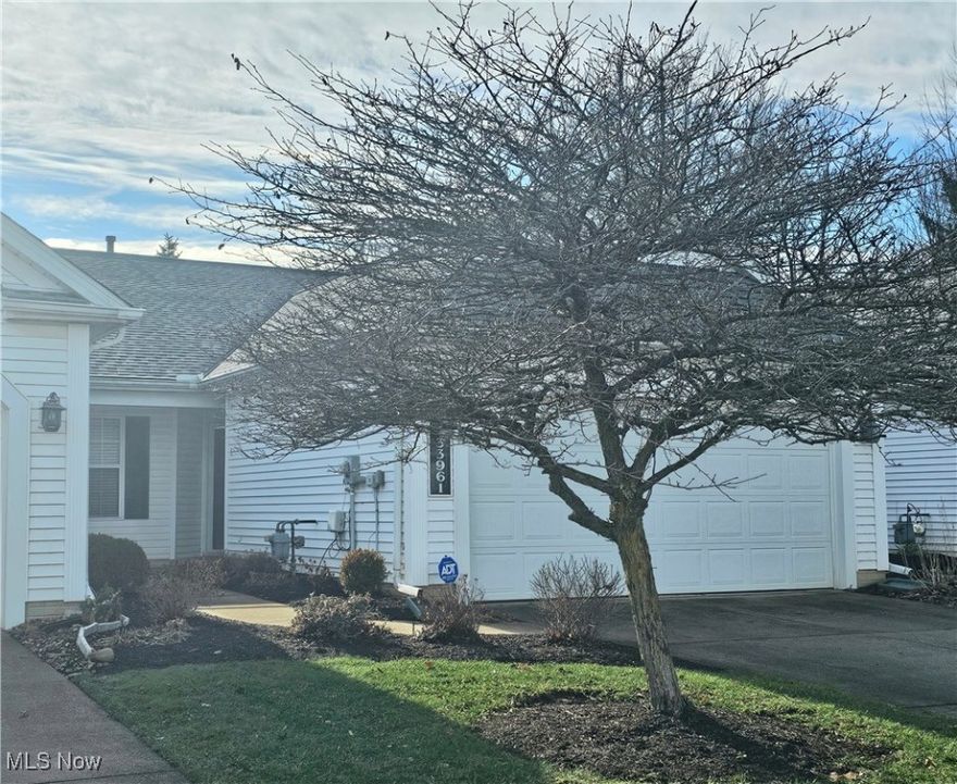 Welcome to 33961 Honeysuckle Ln in Wildflower Subdivision in North Ridgeville**You will enjoy the low maintenance, carefree living of this 2 bedroom/2 full bath ranch style cluster condominium tucked away in back with minimal traffic**You will be wowed by the beautiful finishes and open concept floor plan**The lovely eat-in kitchen includes all stainless steel appliances, pantry, corian countertops, beautiful white cabinetry and ample space for dining**There is also a pass through to the dining room making entertaining a breeze**The formal dining room is the perfect space for holiday get togethers or those special occassions**The living room is spacious and features vaulted ceilings giving the space an open airy feel with lots of natural light**The master suite features a walk-in closet and private master bath with walk-in shower**The second bedroom offers plenty of space and is conveniently located next to the second full bath**The laundry room has its own stationary tub, cabinetry and comes complete with washer and dryer for your convenience**The two car garage has built in shelving for all your storage needs**You will enjoy relaxing on your private front porch or summer barbecues on your back patio**Updates include; central air in 2020 and newer wood flooring, kitchen refrigerator, dishwasher and stove in 2019**Don't miss this lovely condo and all it has to offer***