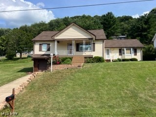 Four bedroom, 2 bath cape cod style home  in Kings Creek bowl area of Weirton. Features 2 bedrooms upstairs and 2 on the main floor with approximately 1900 square feet of living space . The kitchen has beautiful cherry kitchen cabinets and island with access out the back door to a nice patio and deck area to enjoy. The family room addition off of the kitchen room features a vaulted ceiling with a full basement underneath that could be used for storage, play ,or hobbies. The rec. room in the basement has a finished bathroom. This home features a 1 car garage. Give us a call to schedule a tour.