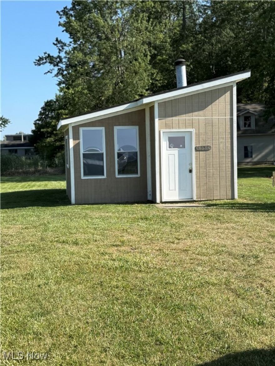 This is approximately a 432 Sq. Ft. little home.  Just use your imagination.  The inside is an open room and does not have any kitchen but does have a bathroom with a toilet and sink.  The awesome thing about this little place is the beautiful view overlooking Lake Erie and your close to Geneva on the Lake.   This would make a great little weekend getaway for your friends or family.  You will enjoy spectacular sunsets with a wide open view.  The state re-did the lake bank and when completed, they did install stairs down to the bottom.
