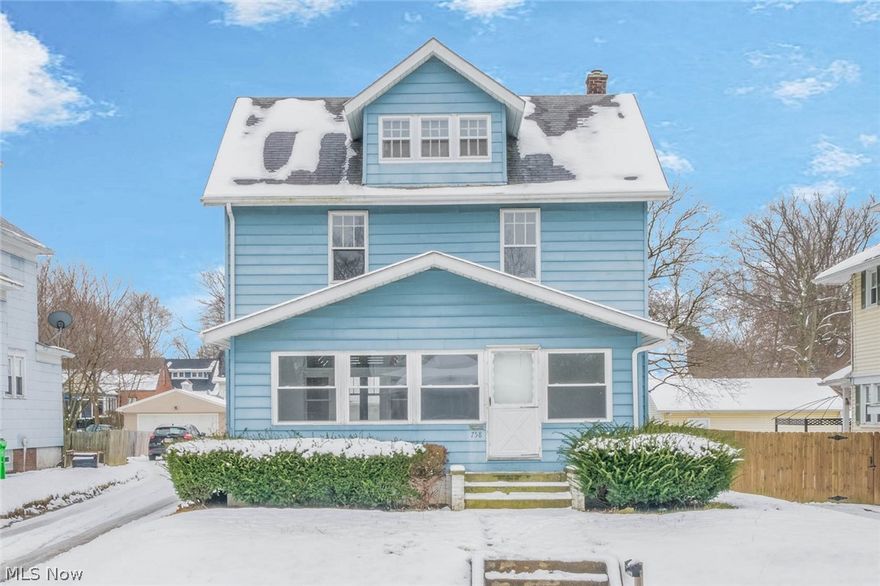 Charming 3 bedroom 1 bath home with first floor laundry.  Other features include original hardwood floors, large 4 car garage & enclosed front porch with new windows.