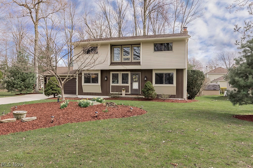 Welcome to this beautifully updated colonial in Hallworth Manor Estates. A spacious bright home with a new kitchen, open floor plan, and versatile living space. On the main floor is the remodeled, upgraded kitchen complete with granite countertops, stainless steel appliances, pantry and sliding door, accessing the new patio for convenient entertaining. Formal dining room and office, both including sunny bay windows, complete the first level. Upstairs you’ll find the primary bedroom with dual closets and ensuite full bathroom. Three more bedrooms with generously sized closets and another full bathroom complete the upper level. In the full finished basement, there’s amazing additional living space, a full bathroom, bonus room, laundry area, and storage. This lower level family room is complete with built-in shelves and a wood burning fireplace; it leads out to a bonus room that has walk out/up access to the landscaped yard and patio. This property and home have been meticulously maintained and updated with the addition of the basement bonus room, vinyl siding, new windows, roof and gutter filters, updated electric panel, driveway replacement, and the genius installation of new storm drains and cleanouts, keeping this property safe from water. Within Mentor school district and near by Lake Catholic, easy access to highways, parks, retail and restaurants. Sellers are offering a home warranty.