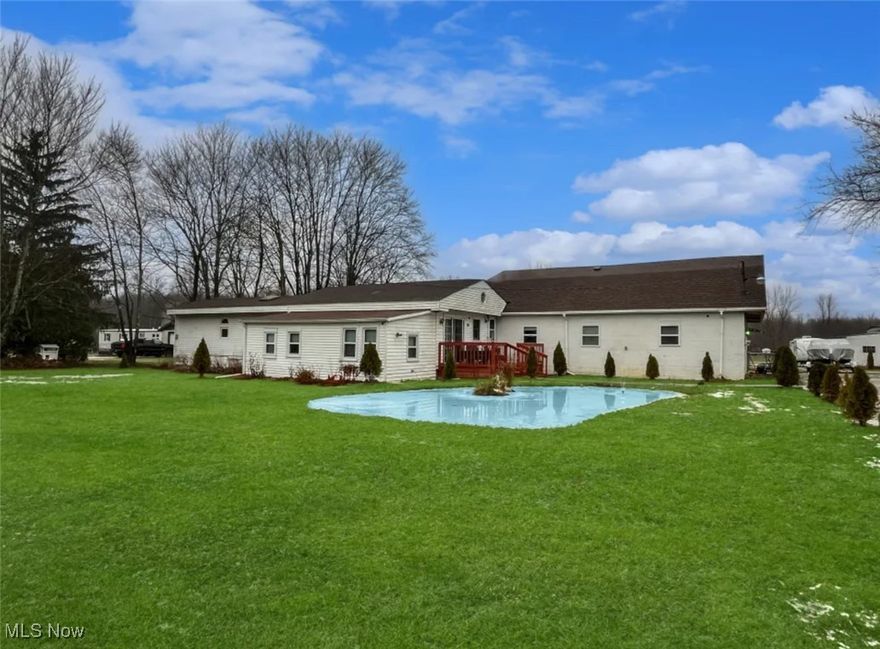 Space and serenity await in this expansive one of a kind home set on 10 beautiful acres. Upon arriving the retention pond sets the tone for what lies beyond. Inside you will find fresh paint and newer flooring , creating a clean and move in ready canvas. The heart of the home is the large kitchen offering an abundance of cabinet space, center island and plenty of room to gather ! A wood burning stove adds warmth and character. Designed with flexibility in mind this home features multiple bedroom areas , and generous flex spaces - Ideal for home offices and hobby rooms. Upstairs  you will find a seperate living area adjoined with two more spaces currently being used as bedrooms offering additional flexibility or In-law suite. Outside the property shines with a shed and stable , making this property well suited for your next outdoor project and plenty of storage space. This is a rare opportunity to own a versatile home with acreage , functionality, and room to grow. A home warranty is included for additional peace of mind. Don't miss your opportunity and book a showing today !
