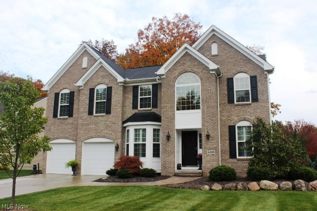House beautiful inside & out! This 4 bedroom, 2 full, 2 half bath shows like a model* Built 2012 with 3319SF (including finished lower level) & 3 car garage (one side is tandem)* 2 story entry with wood floor & plant ledge* Pillar entry to formal dining with bay window, crown molding, chair rail & wood floor* 2 story Great room with wall of windows, gas log fireplace with mantle & fan* 1st floor den* Kitchen with granite, pantry, stainless appliances (range, refrig, microwave & dishwasher) & wood floor* Eating area with wood floor* Half bath with wood floor* 1st floor laundry with sink, closet, cupboards, cubby storage & includes washer & dryer* Loft overlooking foyer & Great room* Master with plant ledge, fan, spacious walk in closet & master bath with double vanity, shower & soaking tub* Additional 3 bedrooms & guest bath on 2nd floor* Audio system, 6 panel doors & plantation blinds* 12 course basement with poured walls, finished rec room, exercise room with mirror wall, laminate flo