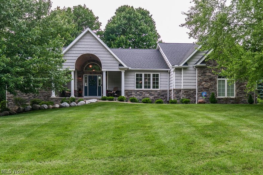 Completely professionally updated 3 bedroom 2.5 bath ranch in Concord Twp!  This home boasts pride of ownership throughout. From the minute you step into this over 2600 sqft ranch you will be impressed with all of the updates and renovations that have been completed. 
Large open concept great room w/Cortec waterproof engineered wood plank flooring, custom solid wood cabinets, limestone counters, stone fireplace w/limestone hearth.  The great room is an open concept to the completely renovated high end kitchen done by Keselman Construction.  Coffee bar, high end appliances (with 5 year transferrable warranty), custom Amish wood and quartz island, under cabinet lighting, sliders to large deck & so much more-- a must see kitchen!  The large owners suite is a retreat w/ ensuite updated bath, large walk-in closet w/custom designed Closet Factory built-ins! There is a large mud room off the garage that has been updated w/bench done by Construction Smith!  Large laundry room w/sink is off th