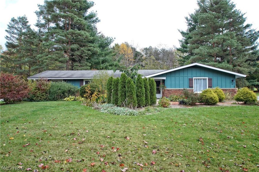 Welcome home to this beautifully updated ranch with 3 bedrooms and 2 full bathrooms! The home features vaulted ceilings in the dining room and living room, a cozy fireplace and large windows. Dark Engineered wood flooring throughout gives a modern and homey feel. The home has been professionally painted inside and out and has all brand new lighting, fans, hardware, crystal door knobs, a new vanity in the bathroom and shower heads. The kitchen has been updated with freshly painted cabinets, stainless steel appliances and new hardware. Other updates include 3 new entry doors, upgraded electrical panel, a beautiful new garage door, baseboard heat covers, and moldings. The windows were replaced with insulated and energy efficient glass.  
Enjoy your time outside on either patio, one in the front or one in the back. Part of the back yard is fully fenced in and the fence was recently sealed. Behind that is a private oasis that features a fire pit and a secluded 12x12 wooden shed that is cur