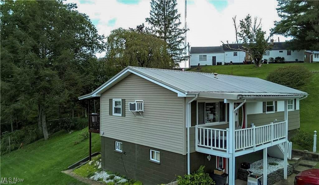 Welcome to 159 Summit Street-a charming raised ranch home offering 1,632 total square ft of living space with a finished basement that also includes a separate laundry room. This 2-bedroom, 1-bath home features a spacious living room and an open-concept kitchen and dining area. The over sized master bedroom stretches 23 feet in length, providing ample space for a king-sized bed with plenty of room. Recent updates have been provided in the bathroom as well as an updated electric panel, taking the home from a 100amp to a 200amp home.With so much room and possibilities for your own personal touch, you can enjoy the peaceful covered front porch, beautiful back porch off from the dining area, a nice deck with backyard, and walk-out lower level. If you love pets, this home is thoughtfully set up for a pet-loving family. With a fully fenced back yard, that offers safe space for play and exercise, along with a convenient dog door providing easy access from the home to the yard, making it perfect for your furry companions. Situated on 0.30-acre lot, this home is located conveniently to shopping and restaurants and just minutes from town. Whether you are a first-time home buyer, downsizing, or looking for a property to make your own, this one is packed with potential!