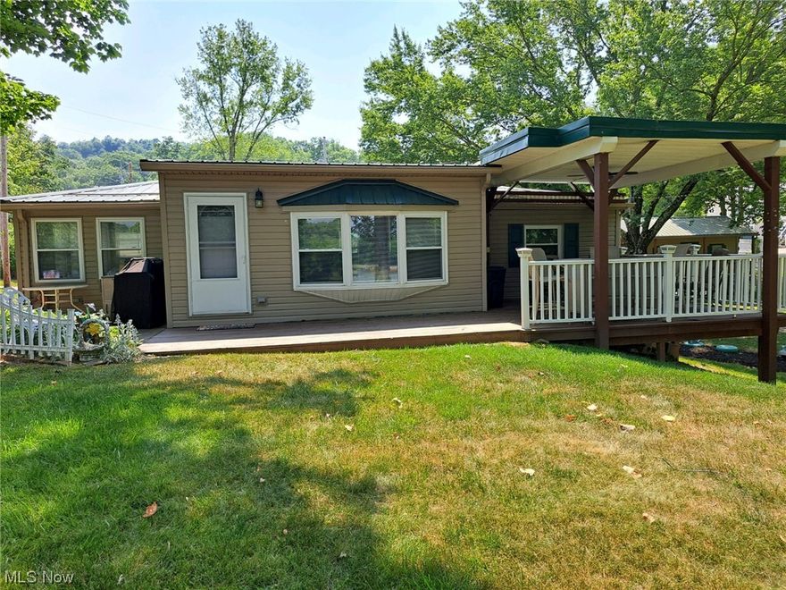 SENECA LAKE WATERFRONT ''COZY CABIN" is FURNISHED and on PRIVATE PROPERTY with BOAT SLIP/DOCK and ready for summer fun!  This 2 bedroom, 2 bath cabin can sleep unlimited lake visitors with extra sleeping quarters in the sunroom, lower bonus room and detached 16x30 Dutch Barn/bunk house with covered patio/deck.  The large living room has amazing water views and enough room for the dining room table and plenty of seating.  Enjoy the water view from the covered front deck with outdoor furniture and grill.  The 1-car, attached garage can store your lake toys.  County water, aeration system, sump pump, B-dry system.  Cabin currently serves as a rental for $252/night or $1600/wk.  Echo Point Association offers a community beach area with annual dues ($25), trash service ($75/yr.), dock install/removal ($50 yr.), cost to gravel roads split between members.  MWCD provides boat decal ($260/yr.) or PWC ($136/yr.), if needed.  No MWCD property fees!  Mineral rights do not transfer.  This property